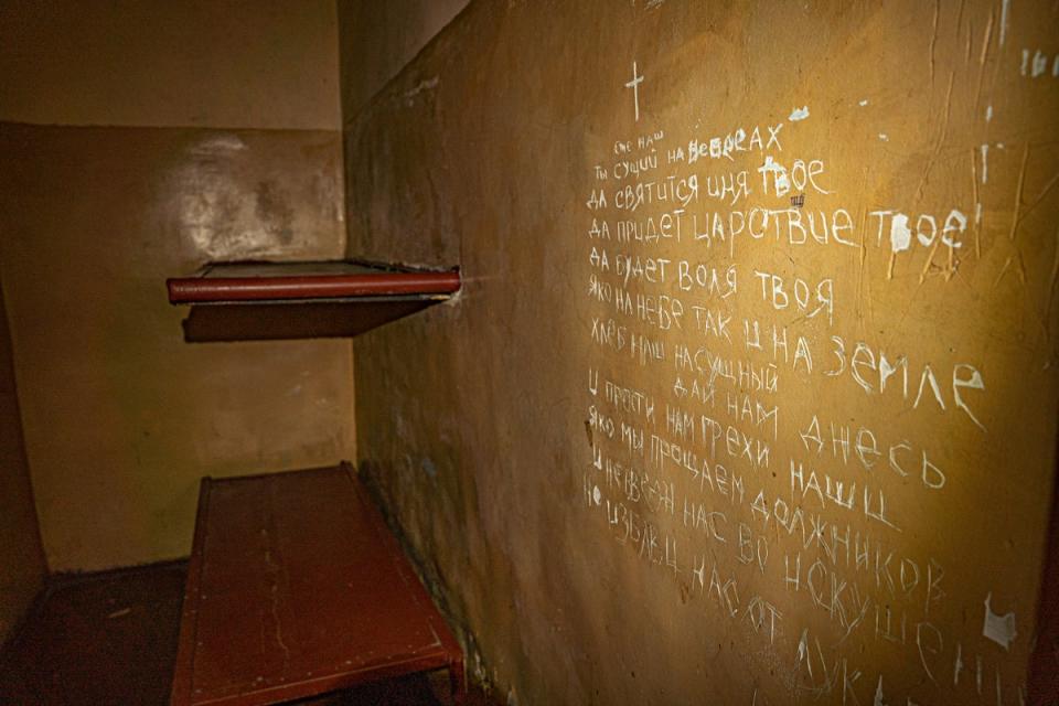 The Lord’s Prayer in Russian is etched into the wall of Oleksander’s tiny cell where he was held and tortured for weeks in Balakiya (Bel Trew)