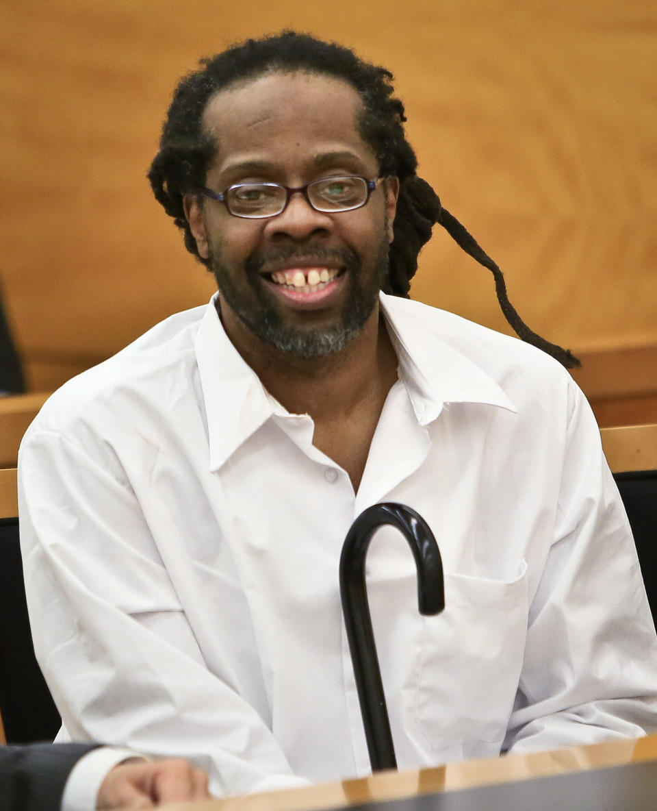 Robert Hill, center, smiles after arriving to Brooklyn Supreme Court, Tuesday May 6, 2014 in New York. Hill and his half brothers Alvena Jennette and Darryl Austin were exonerated in a decades-old conviction investigated by homicide detective Louis Scarcella, whose tactics have come into question. (AP Photo/Bebeto Matthews)