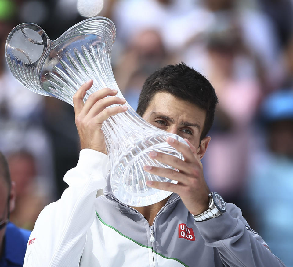 Novak Djokovic, of Serbia, holds his winner's trophy after defeating Rafeal Nadal, of Spain, 6-3, 6-3 during the Sony Open Tennis in Key Biscayne, Fla., Sunday, March 30, 2014. (AP Photo/J Pat Carter)