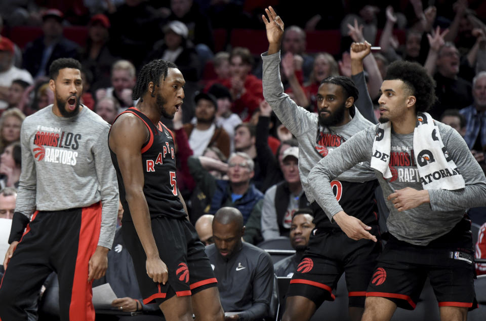 Toronto Raptors guard Immanuel Quickley reacts in front of the Raptors' bench after hitting a shot against the Portland Trail Blazers during the second half of an NBA basketball game in Portland, Ore., Saturday, March 9, 2024. (AP Photo/Steve Dykes)