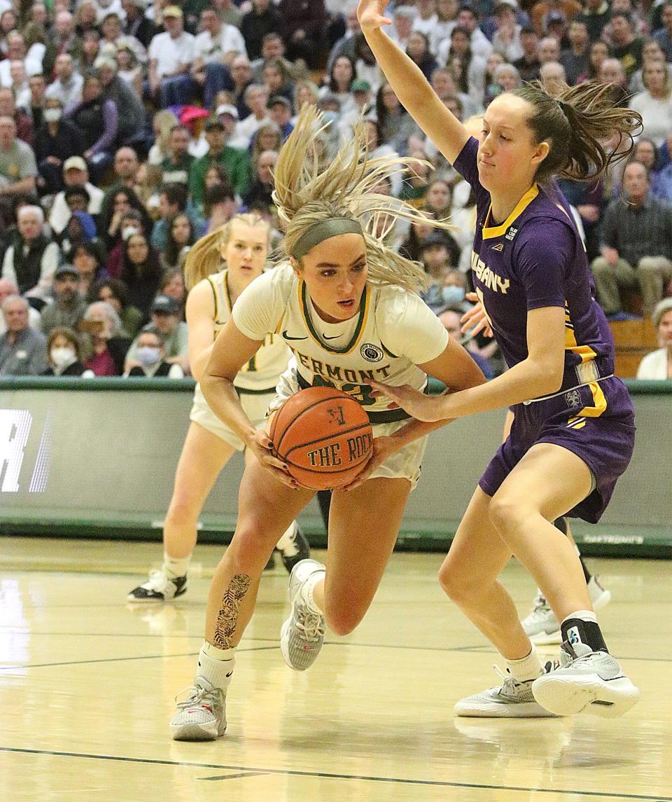 Emma Utterback drives during the first half of the 2023 America East women's basketball championship against Albany.