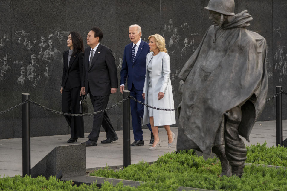 US First Lady Jill Biden, from right, US President Joe Biden, Yoon Suk Yeol, South Korea's president, and Kim Keon Hee,  first lady of South Korea, at the Korean War Memorial in Washington, DC, US, on Tuesday, April 25, 2023. Yoon stressed trust ahead of his high-stakes talks with Biden, whose administration is looking to align more with the long-time US ally on China and Russia. Photographer: Shawn Thew/EPA/Bloomberg via Getty Images