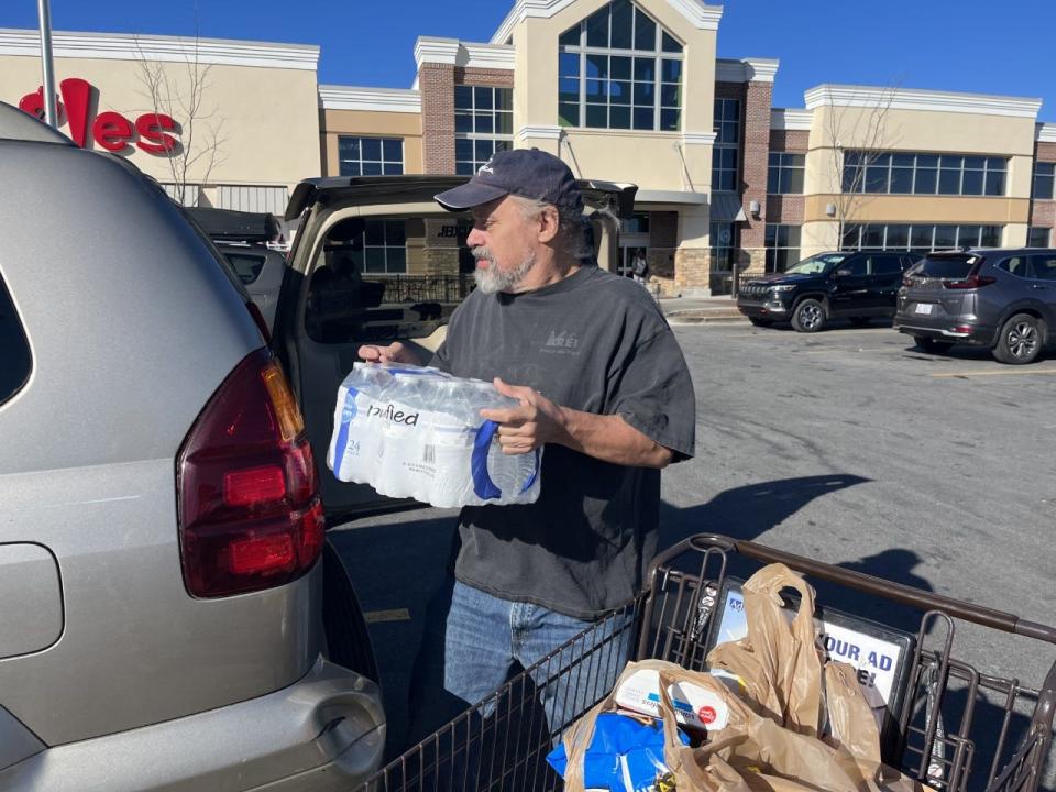 Resident Frank Beaullieu stocks up on water at the Ingles on Airport Road in Arden.