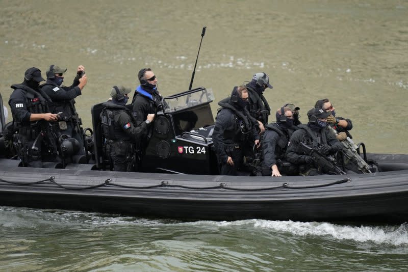 Members of RAID, the tactical unit of the French National Police, patrol the Seine river before the Opening Ceremony of the Paris 2024 Olympic Games on Friday. Photo by Paul Hanna/UPI