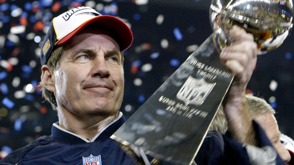 Bill Belichick, head coach of the New England Patriots, holds the Vince Lombardi trophy after winning Super Bowl XXXVIII, on February 1, 2004 at Reliant Stadium in Houston, Texas. The Patriots beat the Carolina Panthers 32-29 to win the game. - Jeff Haynes/AFP/Getty Images