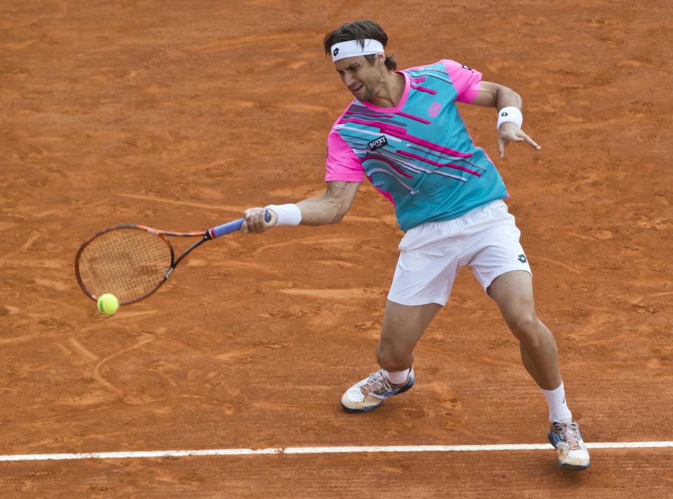 David Ferrer of Spain, returns the ball to Stanislas Wawrinka of Switzerland during their semifinal match of the Monte Carlo Tennis Masters tournament in Monaco, Saturday, April 19, 2014. Wawrinka won 6-1 7-6. (AP Photo/Michel Euler)