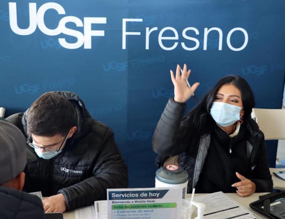 Volunteers help check in Terranova Ranch workers during the Feb. 14, 2023 launch of the Fresno County Rural Mobile Health Program. More than 100 farmworkers participated.