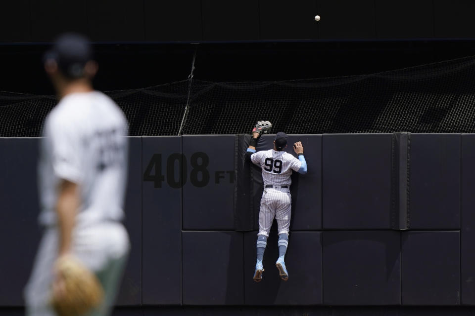 New York Yankees center fielder Aaron Judge (99) watches as a solo home run sails over the outfield wall during the first inning of a baseball game, Sunday, June 20, 2021, at Yankee Stadium in New York. (AP Photo/Kathy Willens)