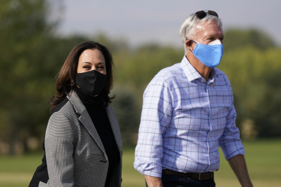 Democratic vice presidential candidate, Sen. Kamala Harris, D-Calif., visits the This Is the Place Monument with former Utah State Sen. Scott Howell, Saturday, Oct. 3, 2020, in Salt Lake City. The monument commemorates the end of the westward journey of Mormon pioneers to Utah as well as early explorers of the West. (AP Photo/Patrick Semansky)