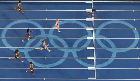 2016 Rio Olympics - Athletics - Final - Women's 400m Hurdles Final - Olympic Stadium - Rio de Janeiro, Brazil - 18/08/2016. Dalilah Muhammad (USA) of USA runs on the way to winning the gold. REUTERS/Fabrizio Bensch