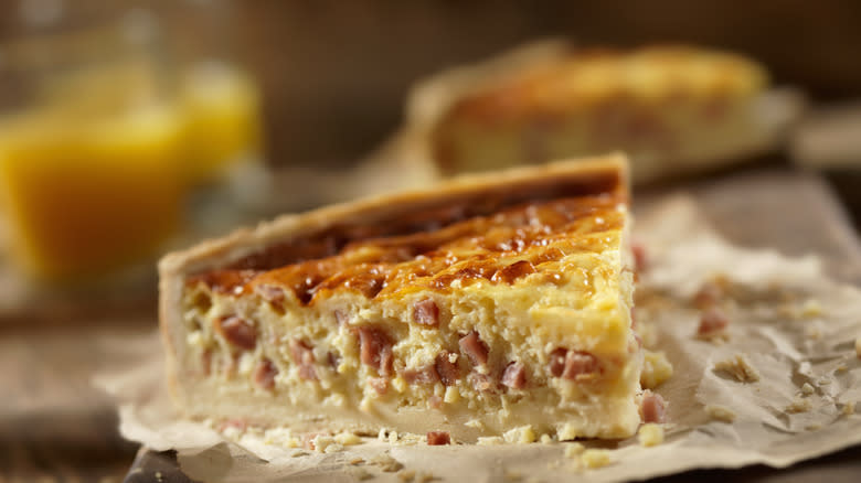 Slice of quiche on plate