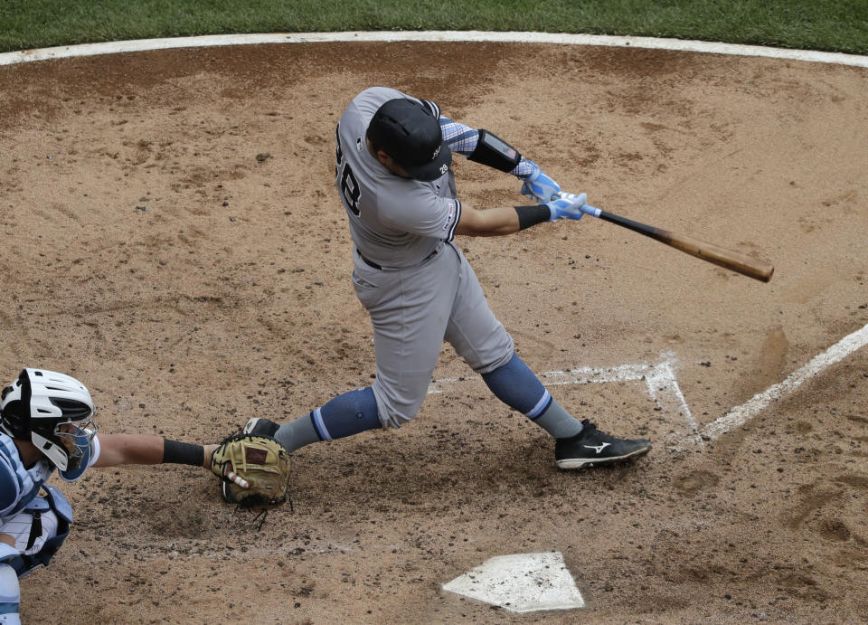 New York Yankees' Austin Romine hits a two-run single against the Chicago White Sox during the third inning of a baseball game in Chicago, Sunday, June 16, 2019. (AP Photo/Nam Y. Huh)