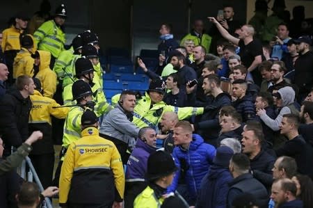 Football Soccer - Manchester City v Manchester United - Barclays Premier League - Etihad Stadium - 20/3/16 Manchester City fans clash with Manchester United fans as they are seperated by police at the end of the match Reuters / Phil Noble Livepic