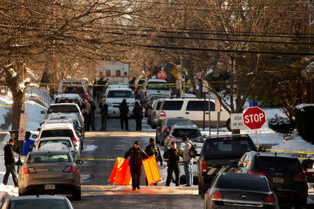 Police block the road after officer-involved shooting in Harrisburg, Pennsylvania, U.S., January 18, 2018. REUTERS/Daniel Shanken