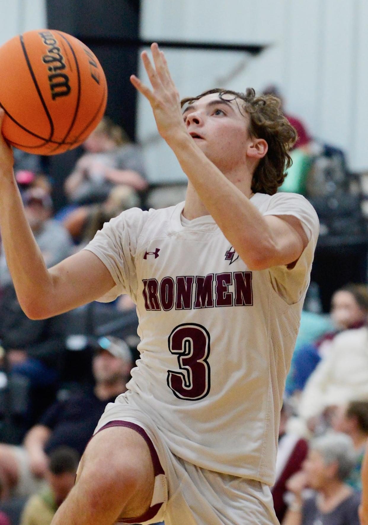 Spencer Bullen attacks the rim for Nowata High School during varsity boys action on Homecoming, Jan. 27, 2023.