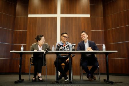 James Lim speaks about his father, Pastor Hyeon Soo Lim, who returned to Canada from North Korea after the DPRK released Lim on August 9 from being held for 31 months, alongside family spokesperson Lisa Pak (L) and church spokesperson Richard Ha (R), during a news conference at the Light Presbyterian Church in Mississauga, Ontario, Canada August 12, 2017. REUTERS/Mark Blinch