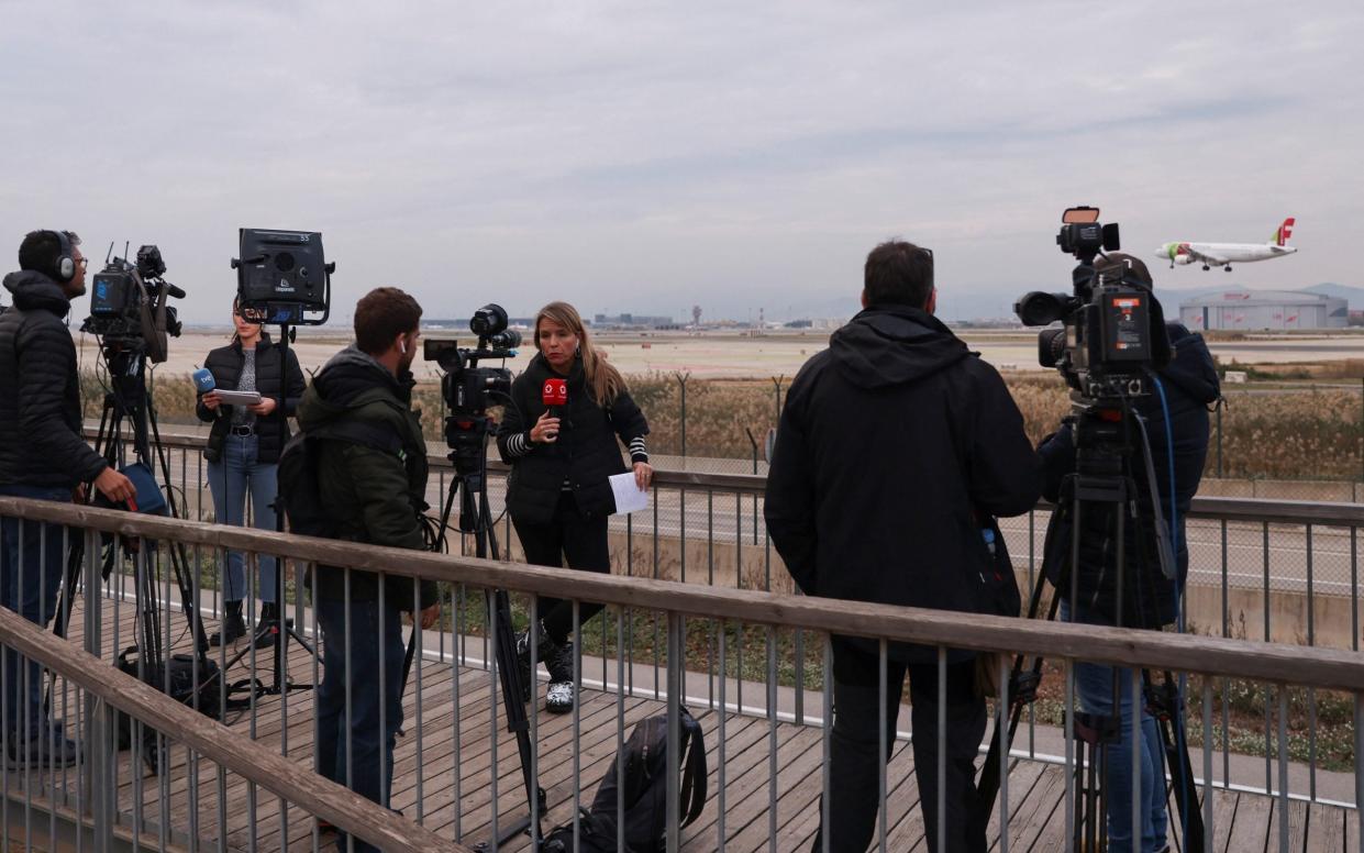 Journalists gather after a flight from Morocco to Turkey made an emergency landing at Barcelona's El Prat airport - Nacho Doce/Reuters