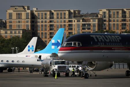 Republican presidential nominee Donald Trump's campaign plane (R) sits on the same tarmac as Democratic nominee Hillary Clinton's campaign plane (L), at Ronald Reagan Washington National Airport in Washington, U.S., September 16, 2016. REUTERS/Carlos Barria