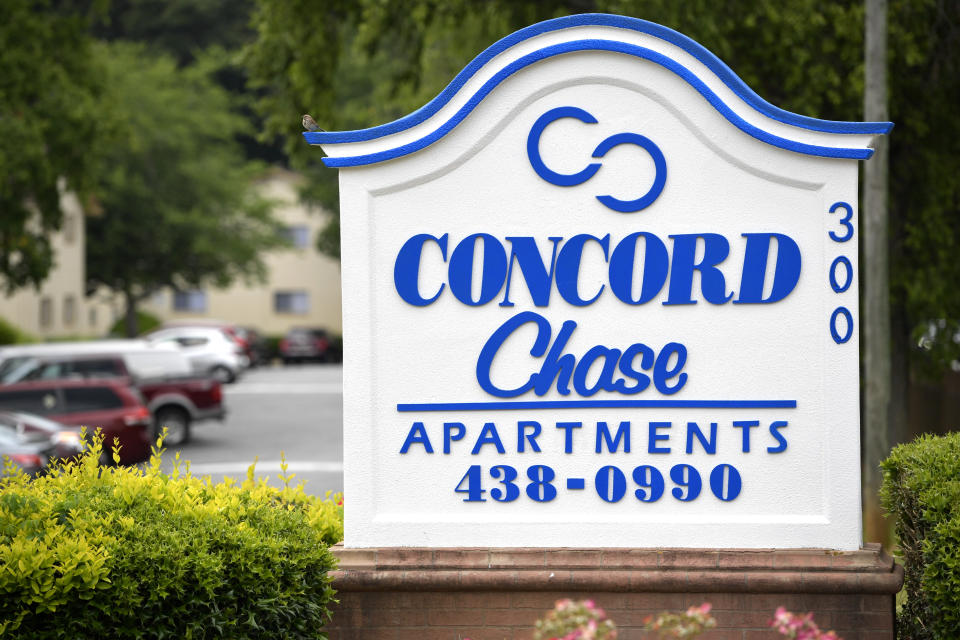 This Monday, June 14, 2021 photo shows a sign for the apartment complex in Smyrna, Ga., where Johnny Lorenzo Bolton was shot in December by the Cobb County Sheriff's Office SWAT team. Bolton was on a couch in his apartment near Atlanta \ when police serving a narcotics search warrant burst through the front door with no warning. A lawyer for the family says that when the 49-year-old Bolton stood up from the couch, at least one of the officers fired, hitting him with two bullets. (AP Photo/Mike Stewart)