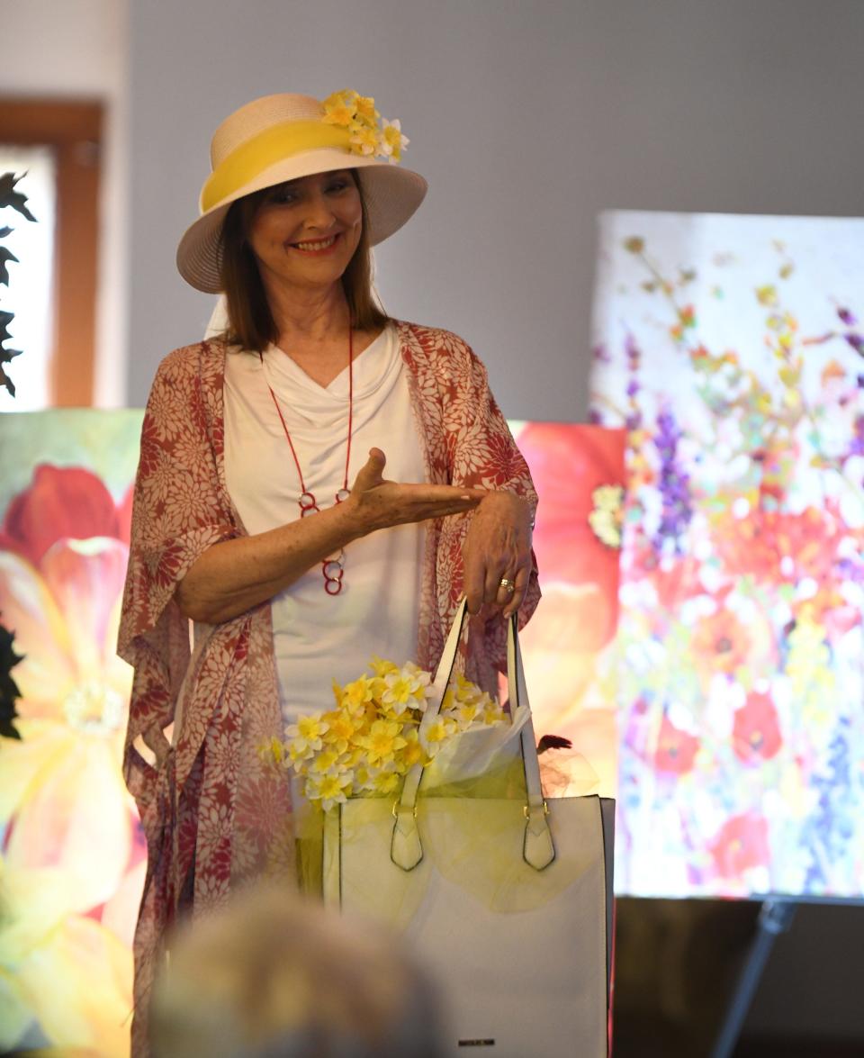 Suzie Thomas represents daffodils in the Massillon Woman&#39;s Club Daffodil Luncheon 2022 Floral Fantasy - The Language of Flowers. Flowers represented different emotions during Victorian times.