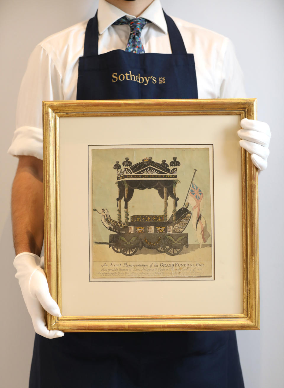 A hand-coloured contemporary print, depicting Nelson’s funeral carriage (Tristan Fewings/Getty Images for Sotheby’s/PA)