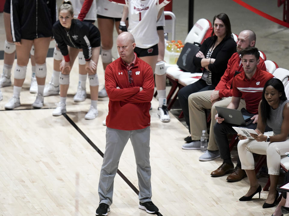 In this Dec. 6, 2019, photo, Wisconsin volleyball coach Kelly Sheffield looks on during an NCAA college volleyball match against Illinois State, in Madison, Wisc. Wisconsin’s football team continues practicing amid a pandemic knowing the start of its season is only a week away. Members of the Badgers’ other fall sports teams must take a more patient approach. (Steve Apps/Wisconsin State Journal via AP)