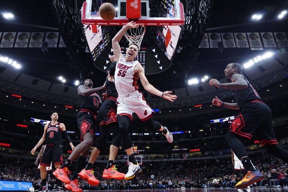 Miami Heat forward Duncan Robinson (55) loses control of the ball during the second half of an NBA basketball game against the Chicago Bulls in Chicago, Saturday, Nov. 18, 2023. (AP Photo/Nam Y. Huh)