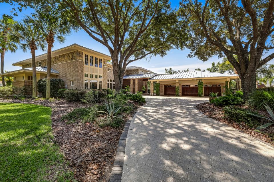 This chic contemporary home at 4409 Catheys Club Lane offered views of the 13th fairway at Glen Kernan to its new owners. Sold for $2,675,000 on Jan. 24, the six-bedroom, 6.5-bath home offers unique exterior details, including custom tile, a metal roof, circular pavered driveway and an electric-vehicle charging station.