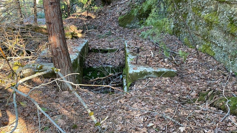 All that’s left of the old Providence Mine is a crumbling foundation and a 14-foot mine shaft right next to the public trail through the site. Construction workers helping remediate the site dropped an old boulder on the mine shaft, collapsing the cover over it. Storm damage helped fill in some of the old shaft, but it’s still a physical safety risk.
