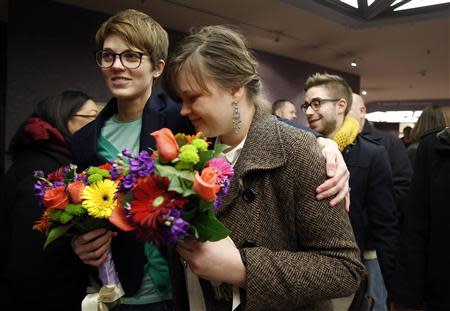 Natalie Dicou (L) and her partner Nicole Christensen wait to get married at the Salt Lake County Clerks office in Salt Lake City, Utah, December 20, 2013. REUTERS/Jim Urquhart