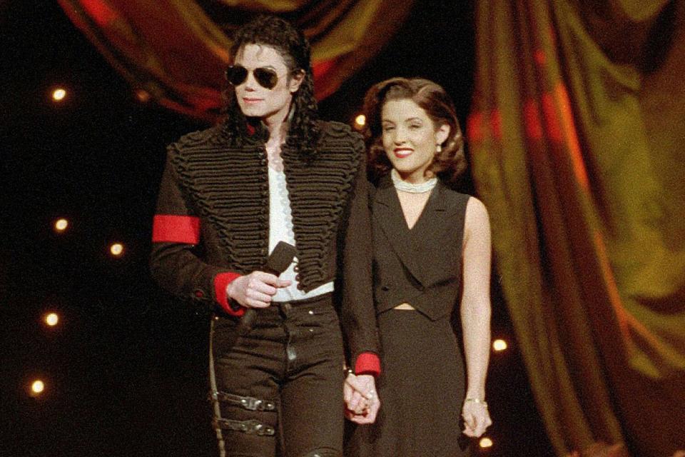 Mandatory Credit: Photo by Bebeto Matthews/AP/Shutterstock (13712979a) Michael Jackson and Lisa Marie Presley-Jackson acknowledge applause from the audience after coming out onstage to open the 11th annual MTV Video Music Awards at New York's Radio City Music Hall, Sept. 8, 1994. Presley, singer and only child of Elvis, died, after a hospitalization, according to her mother, Priscilla Presley. She was 54 Obit Lisa Marie Presley, New York, United States - 08 Sep 1994