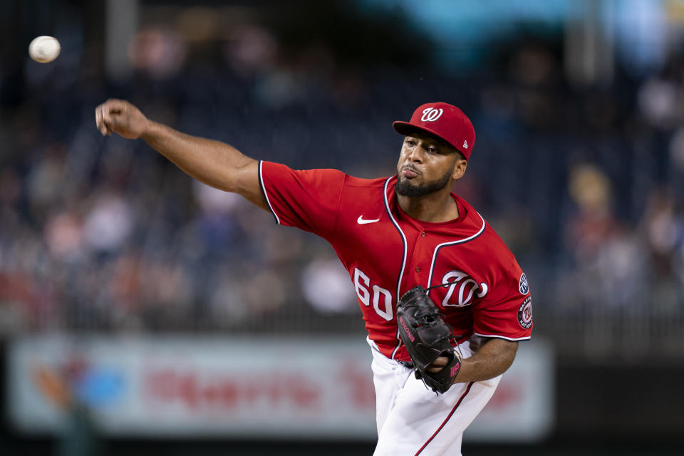 Washington Nationals starting pitcher Joan Adon delivers during the fourth inning of the second game of a baseball doubleheader against the Atlanta Braves, Sunday, Sept. 24, 2023, in Washington. (AP Photo/Stephanie Scarbrough)