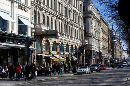 FILE PHOTO: People walk at the Esplanade in Helsinki, Finland, May 6, 2017. REUTERS/Ints Kalnins/File Photo