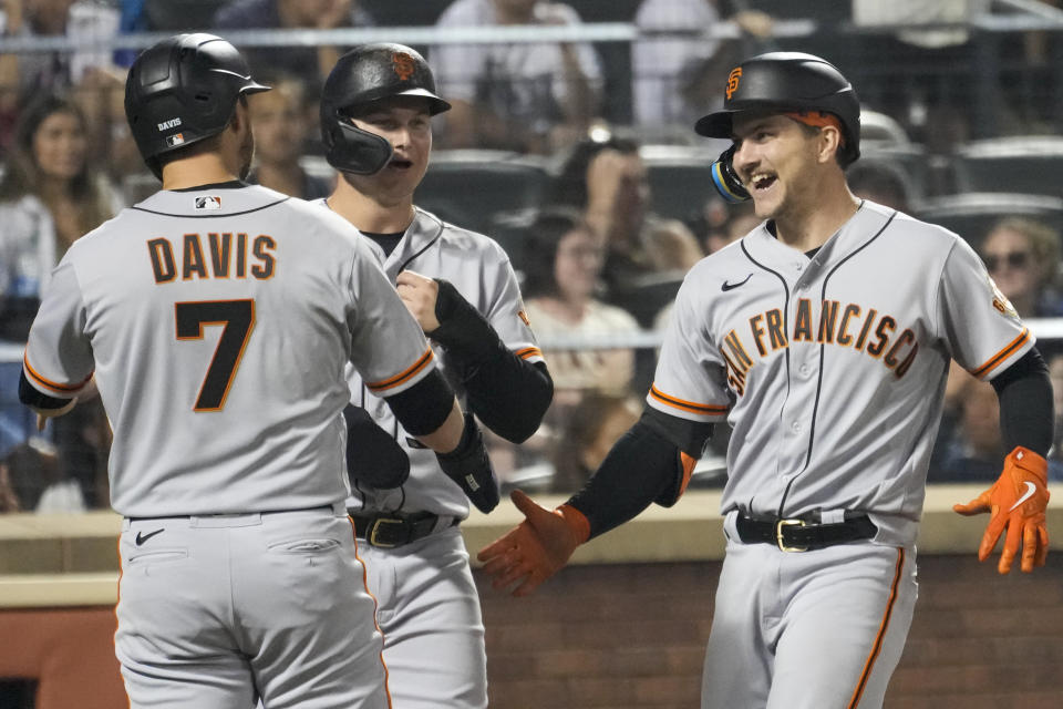 San Francisco Giants' Patrick Bailey, right, celebrates after his three-run home run with J.D. Davis (7) and Joc Pederson, center, during the eighth inning of a baseball game against the New York Mets, Friday, June 30, 2023, in New York. (AP Photo/Mary Altaffer)
