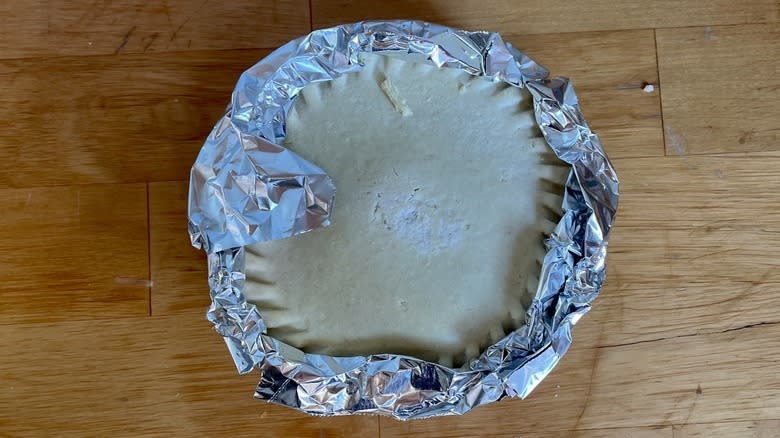 Frozen pot pie with foil on edge