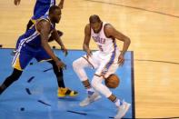 May 28, 2016; Oklahoma City, OK, USA; Oklahoma City Thunder forward Kevin Durant (35) loses control of the ball while guarded by Golden State Warriors forward Draymond Green (23) during the fourth quarter in game six of the Western conference finals of the NBA Playoffs at Chesapeake Energy Arena. Mandatory Credit: Mark D. Smith-USA TODAY Sports