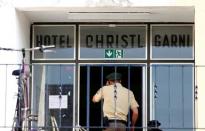 Police enters a former hotel, where the 27-years-old Syrian suspect lived, after an explosion in Ansbach near Nuremberg, Germany, July 25, 2016. REUTERS/Michaela Rehle