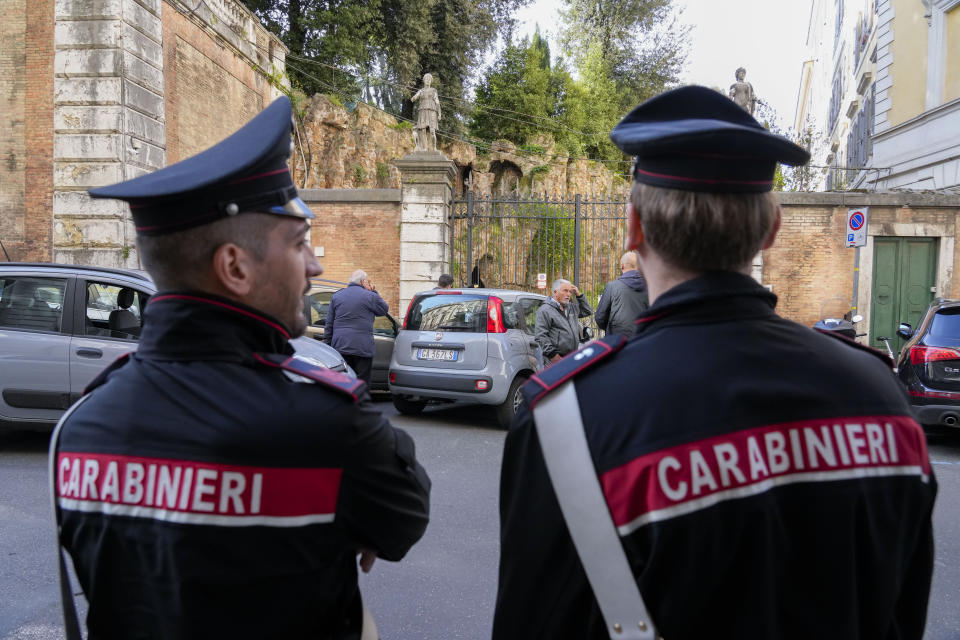 Carabinieri police officers stand in front of The Casino dell'Aurora, also known as Villa Ludovisi, as they execute an eviction order, in Rome, Thursday, April 20, 2023. Texas-born Princess Rita Boncompagni Ludovisi, who lives in the villa containing the only known ceiling painted by Caravaggio, is facing a court-ordered eviction Thursday, in the latest chapter in an inheritance dispute with the heirs of one of Rome's aristocratic families. (AP Photo/Andrew Medichini)