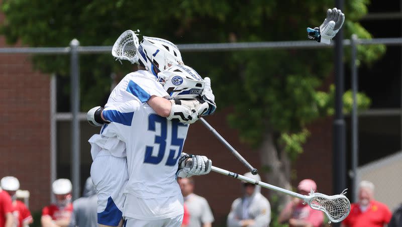 Fremont’s Owen Hill (1) celebrates the second overtime game-winning goal with Cam Jenkins (35) against Davis in the 6A boys lacrosse state semifinal in Salt Lake City on Wednesday, May 24, 2023. Fremont won in the second overtime.