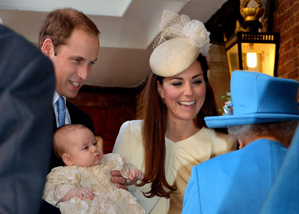  Prince William, Duke of Cambridge and his wife Kate Middleton, Duchess of Cambridge, speak with Queen Elizabeth II as they hold their son Prince George of Cambridge at Chapel Royal in St James's Palace in central London on October 23, 2013, upon arrival for the christening of the three month-old prince