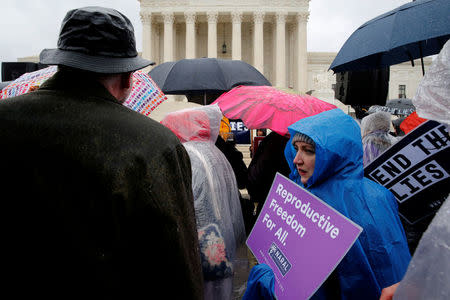 Pro-abortion rights demonstrators rally outside as the U.S. Supreme Court hears oral arguments in the abortion case National Institute of Family and Life Advocates (NIFLA) v. Becerra, in Washington, U.S. March 20, 2018. REUTERS/Jonathan Ernst