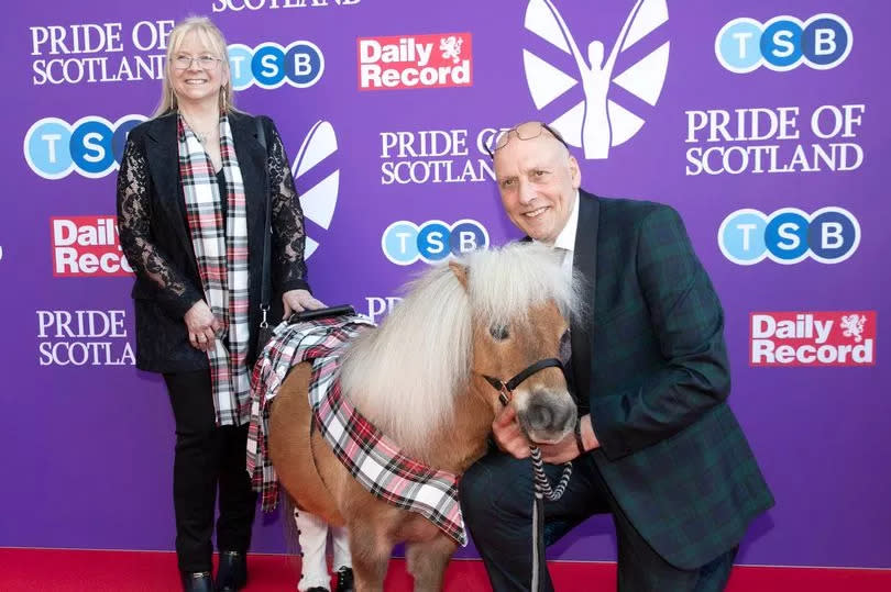 Kilted pony Wilson with winners John and Elaine Sangster