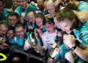 Formula One - F1 - Singapore Grand Prix - Marina Bay, Singapore- 18/9/16 Mercedes' Nico Rosberg of Germany celebrates winning the race with teammates. REUTERS/Edgar Su