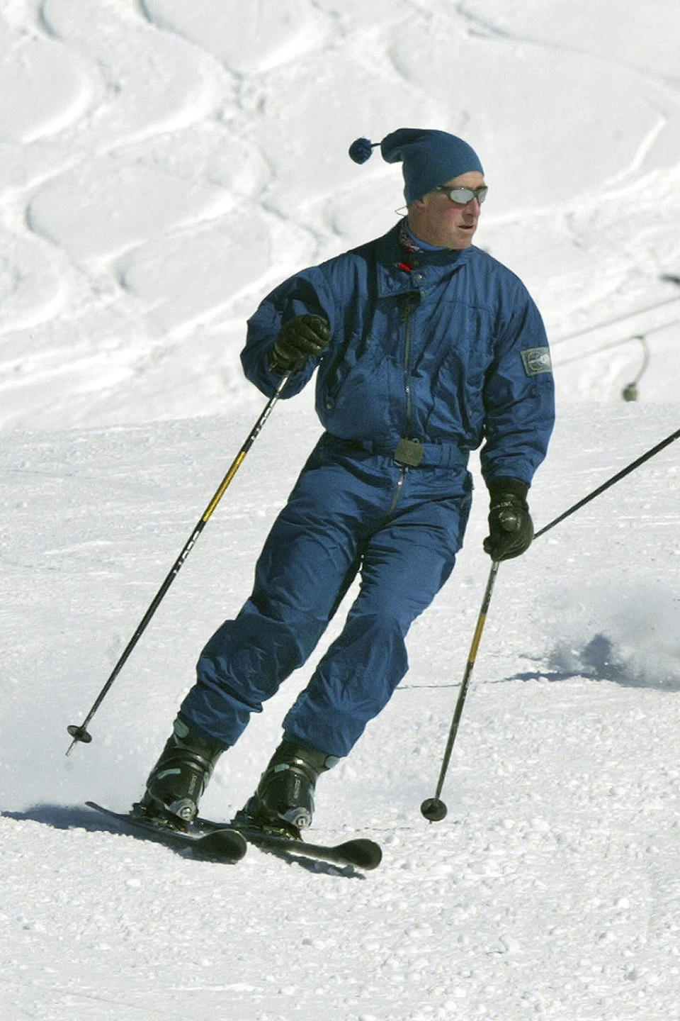 FILE - Britain's Prince Charles during a family skiing holiday in Klosters, Switzerland, March 2004. The announcement on Monday Feb. 5, 2024 that King Charles III has been diagnosed with cancer has come as a shock to many in Britain, largely because the 75-year-old monarch has generally enjoyed good health through the years. (AP Photo/Michael Probst, File)