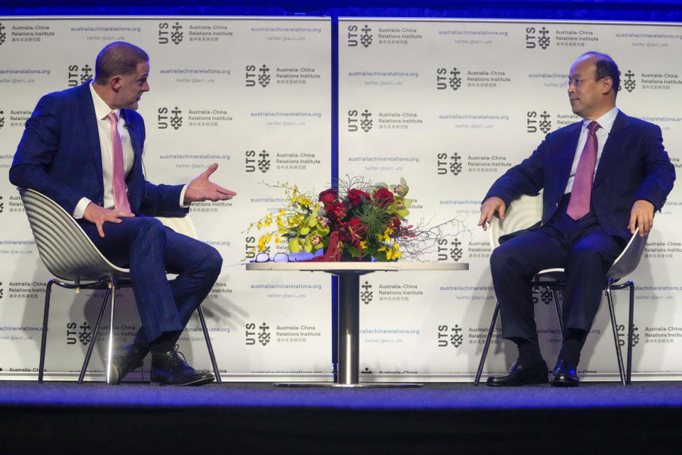 Professor James Laurenceson, left, director of the Australia China Relations Institute asks questions of China's Ambassador to Australia, Xiao Qian following his address on the state of relations between Australia and China at the University of Technology in Sydney, Australia, Friday, June 24, 2022.(AP Photo/Mark Baker)