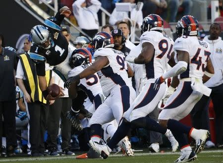 Carolina Panthers' quarterback Cam Newton (1) is knocked out of bounds by Denver Broncos' Von Miller (58) during the second quarter of the NFL's Super Bowl 50 football game in Santa Clara, California February 7, 2016. REUTERS/Stephen Lam