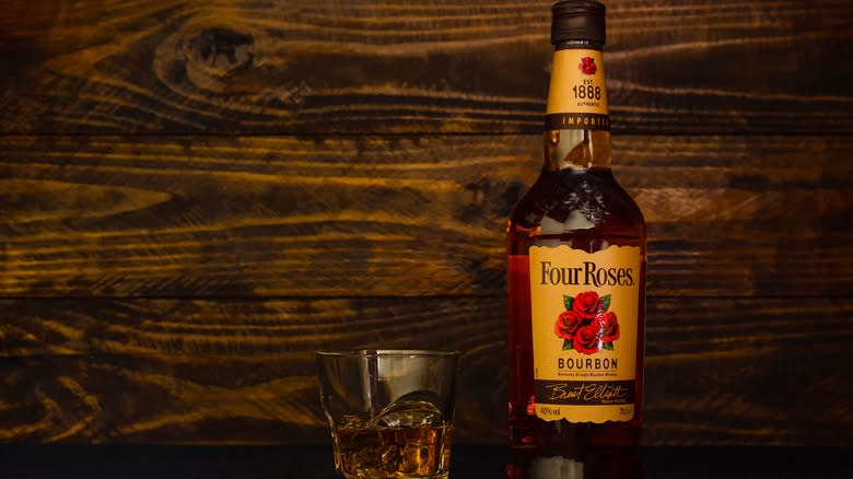 Bottle of Four Roses Bourbon with glass