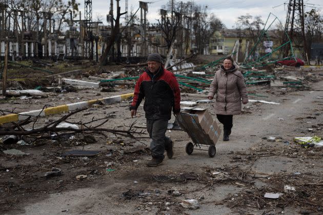 Local residents walks through the destroyed residential area on April 4, 2022 in Bucha, Ukraine. (Photo: Anastasia Vlasova via Getty Images)