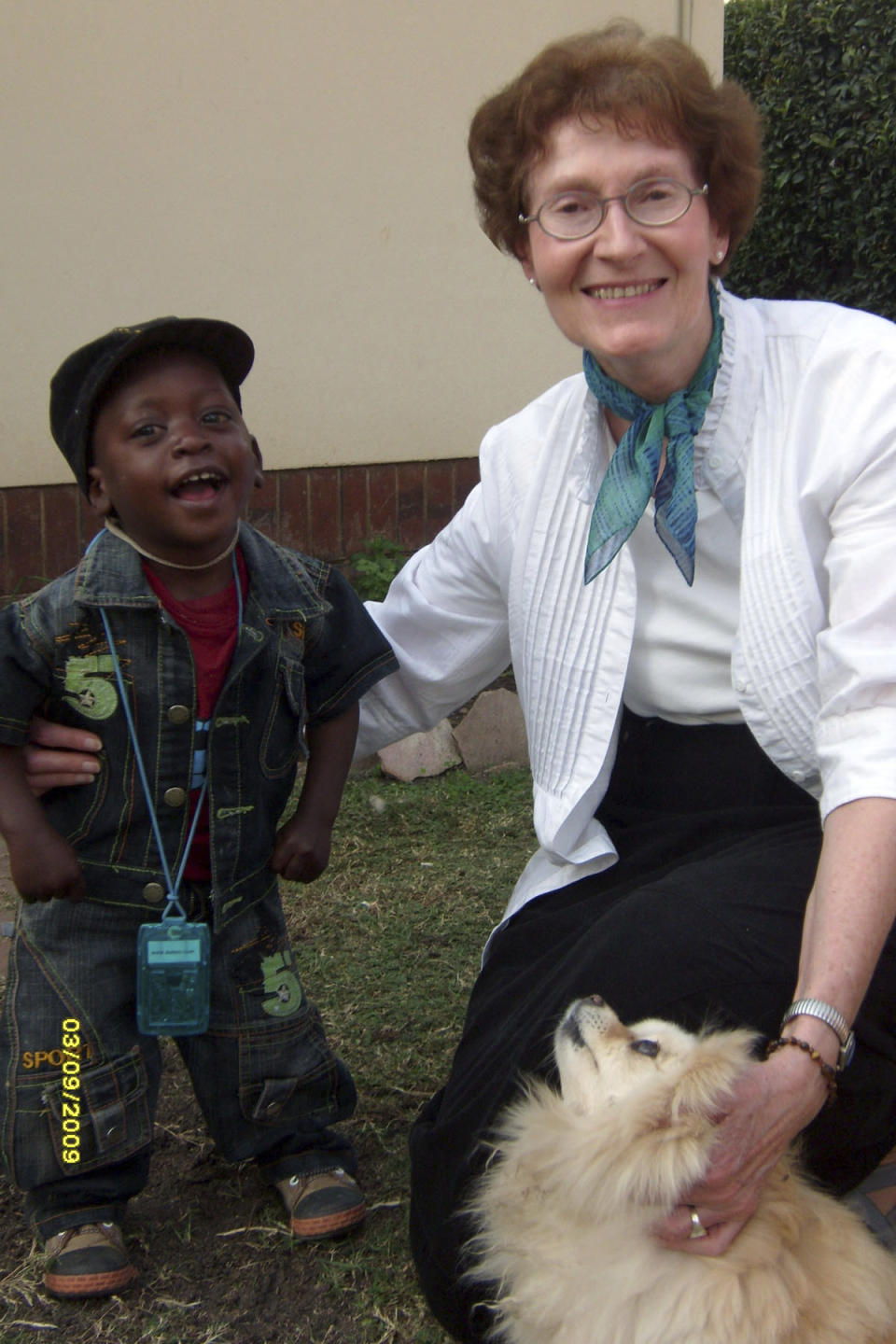 This 2012 photo provided by the Maryknoll Sisters shows Sister Janice McLaughlin with a child in Zimbabwe. McLaughlin, a nun who was jailed and later deported by white minority-ruled Rhodesia, later Zimbabwe, for exposing human rights abuses, died on March 7, 2021, in Maryknoll, N.Y. She was 79. (Maryknoll Sisters via AP)