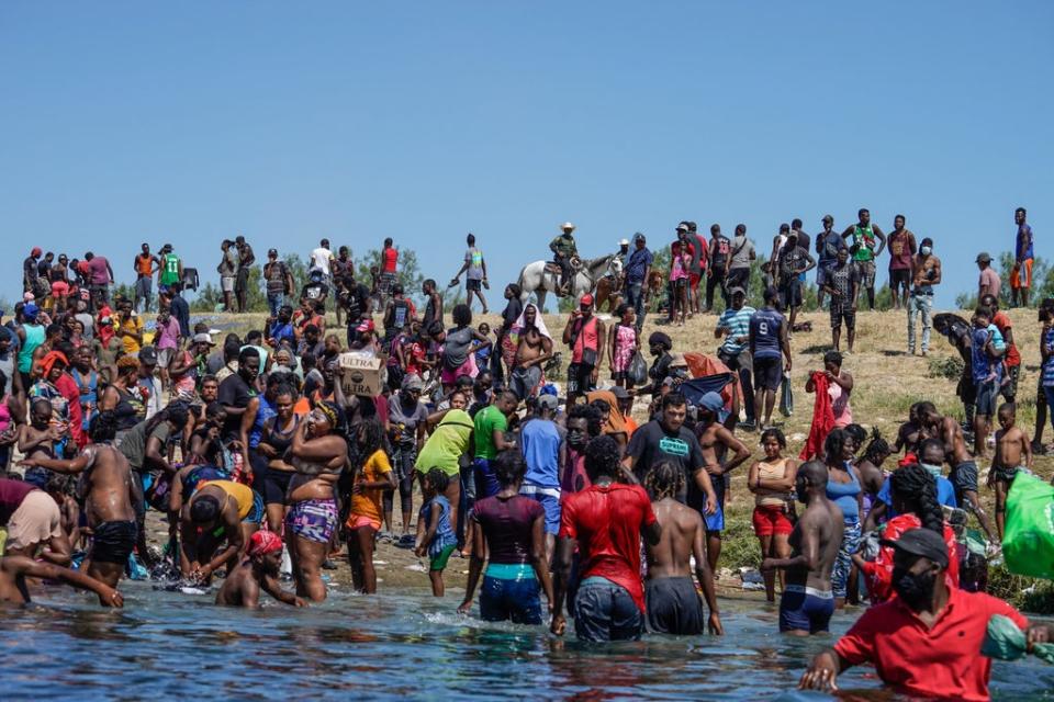 Tens of thousands of people arrived at the US border and camped out near the Acuna Del Rio International Bridge in Del Rio, Texas, as pictured on 19 September. (AFP via Getty Images)